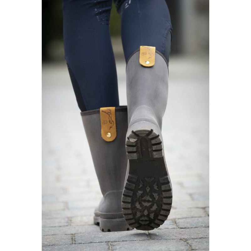 Rain boots for horse riders during wet weather at the stable.