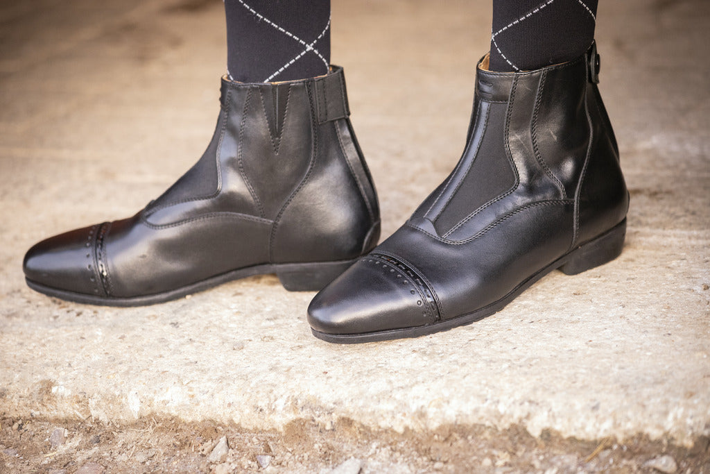 Women’s horse riding ankle boots with an elegant leather design.